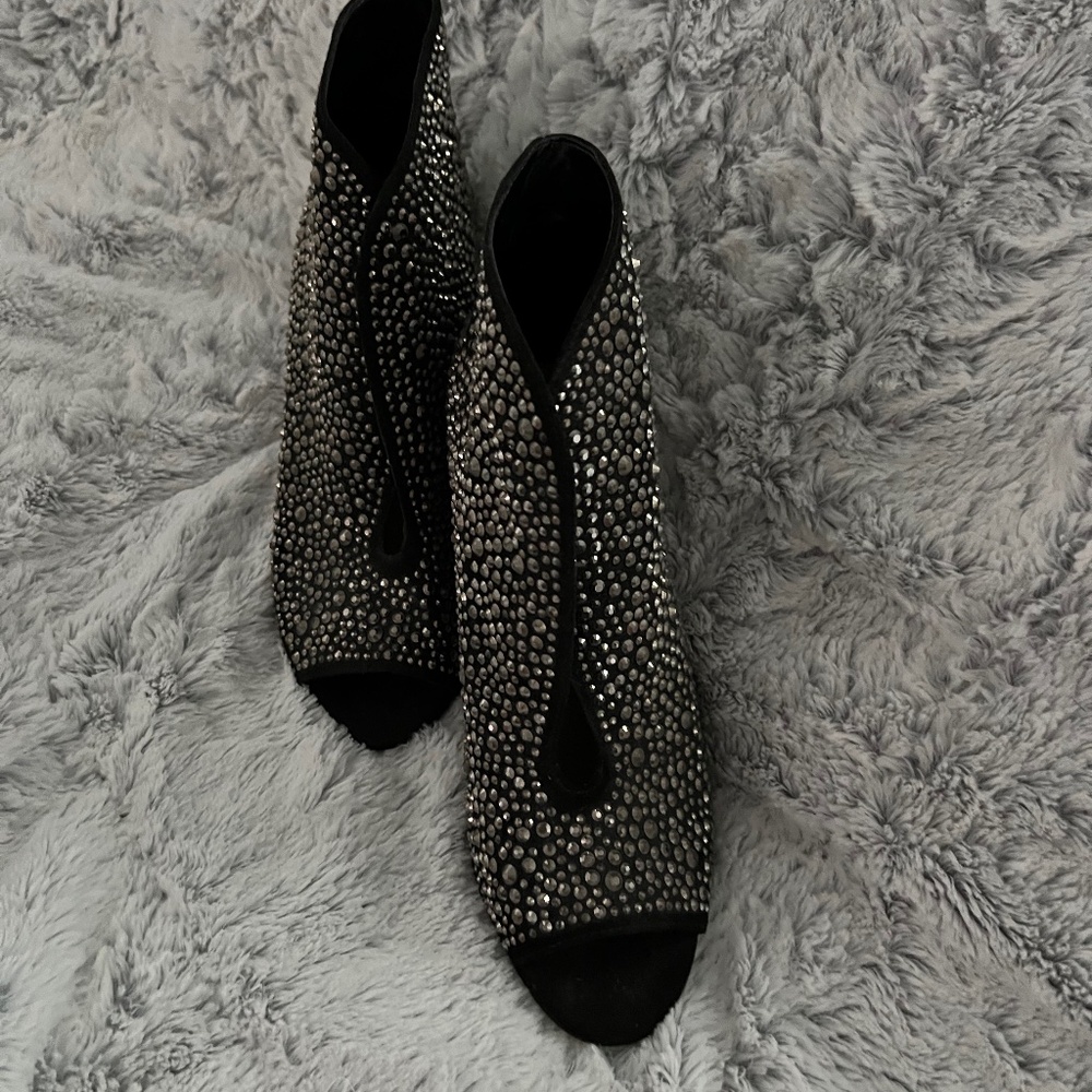 Bejeweled high heel boots.